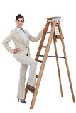 Smiling businesswoman climbing the career ladder