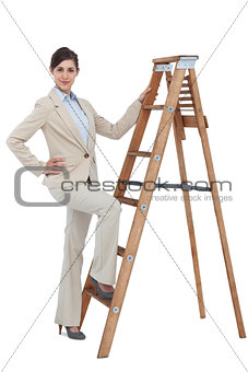 Smiling businesswoman climbing the career ladder