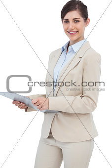 Smiling businesswoman with clipboard