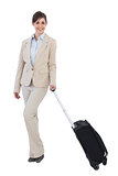 Happy businesswoman posing with suitcase