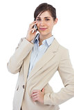 Businesswoman on the phone looking at camera