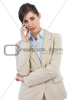 Serious businesswoman on the phone