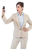 Angry businesswoman on the phone