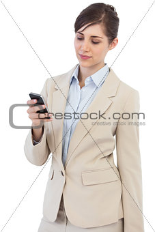 Pensive businesswoman posing with phone