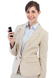 Cheerful businesswoman posing with phone