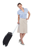 Cheerful classy businesswoman carrying suitcase
