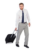 Serious businessman with suitcase