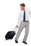 Annoyed businessman with suitcase