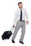 Thoughtful businessman posing with suitcase