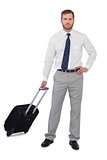 Serious handsome businessman with suitcase
