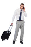 Handsome businessman with suitcase and phone