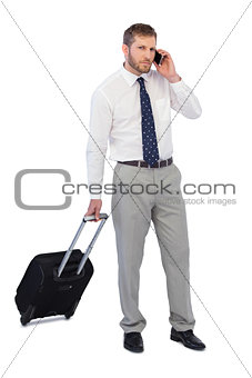 Handsome businessman answering phone