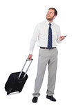 Cheerful businessman with phone and suitcase