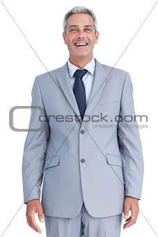 Confident businessman smiling at camera
