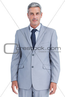 Serious confident businessman posing