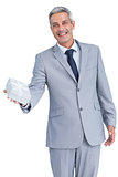 Good looking businessman offering gift