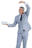 Funny businessman offering gift