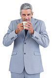 Businessman drinking cup of coffee