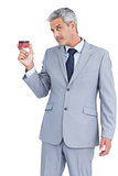 Businessman showing credit card