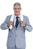 Self assured businessman with white towel on shoulders