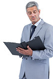 Disappointed businessman holding clipboard