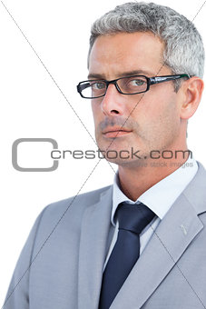 Severe businessman wearing glasses
