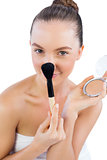 Funny model holding powder compact and brush
