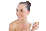 Smiling woman with nail file
