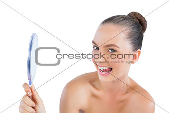 Funny woman holding mirror