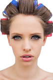 Model with hair curlers in close up