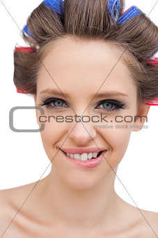 Cheerful model with hair curlers