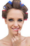 Portrait of young model with hair curlers