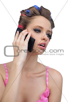 Calling model posing wearing hair rollers
