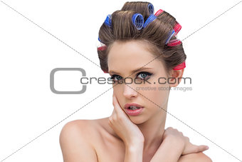 Lovely model posing with hair curlers