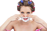 Young model with fingers on face and shaving foam