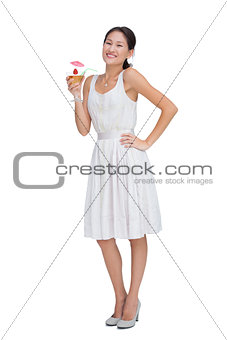Cheerful brunette holding cocktail