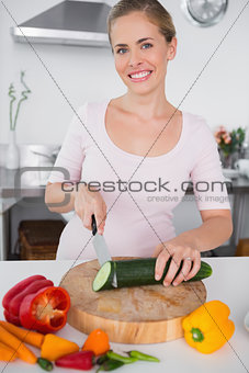 Smiling woman cooking