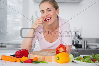 Attractive woman eating vegetables