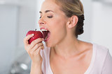 Pretty woman munching apple