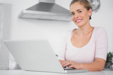 Cheerful woman with laptop