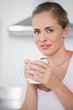 Radiant blonde woman with coffee