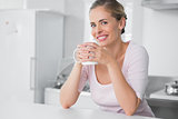 Radiant woman having coffee