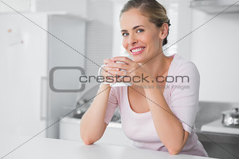 Radiant woman having coffee