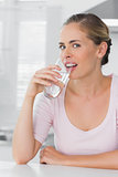 Attractive woman drinking water