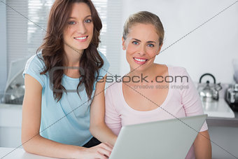 Cheerful women with laptop