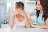 Woman looking at her overwhelmed friend