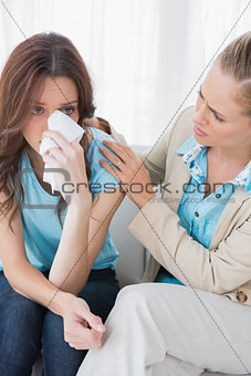 Therapist looking at her patient crying