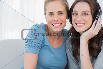 Pretty women posing while listening to music
