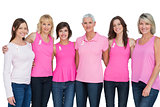 Happy women wearing pink for breast cancer awareness