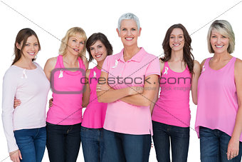 Enthusiastic women posing with pink tops for breast cancer